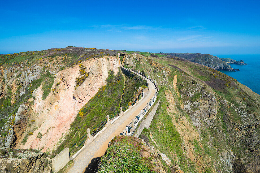 Road connecting the narrow isthmus of Greater and Little Sark, Channel Islands, United Kingdom, Europe