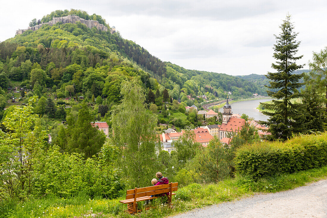 Mother and 4 year old boy having a rest on a bench, Koenigstein castle and the river Elbe, Saxony Switzerland, Elbe sandstone mountains, Dresden, Saxony, Germany, Europe