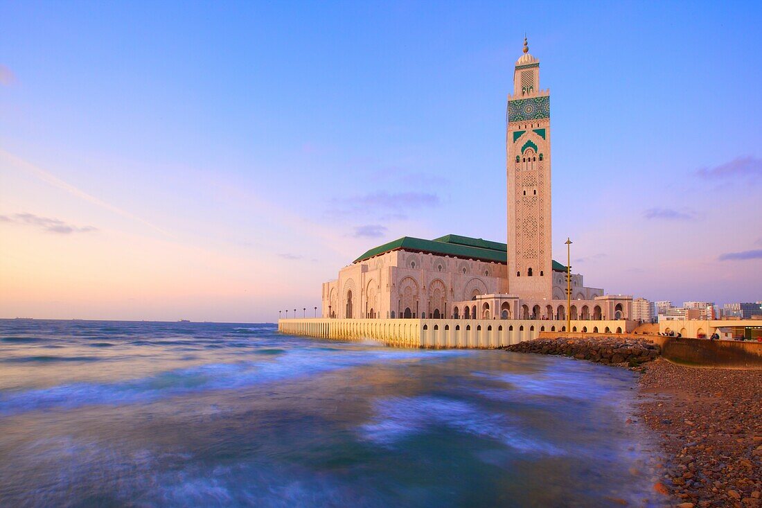 Exterior of Hassan ll Mosque and coastline at dusk, Casablanca, Morocco, North Africa, Africa