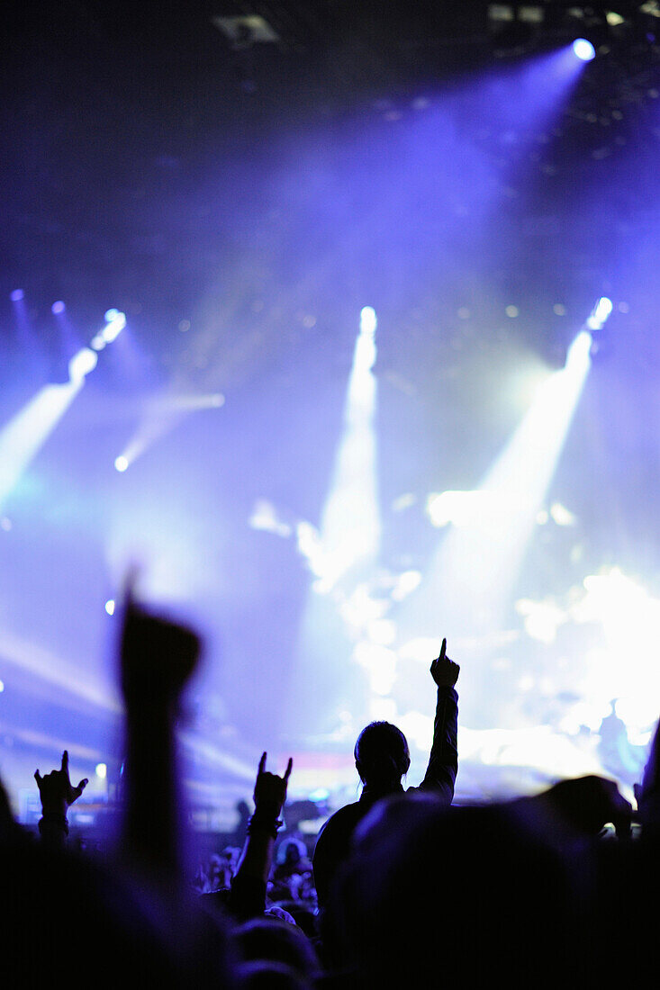 fans at concert with light show,Germany