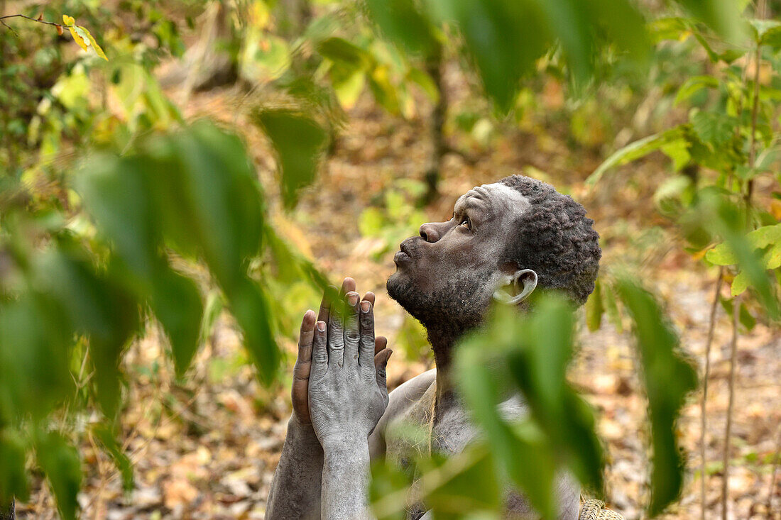 Bushman praying in the woods, Selous Nature Reserve, Tanzania, Africa