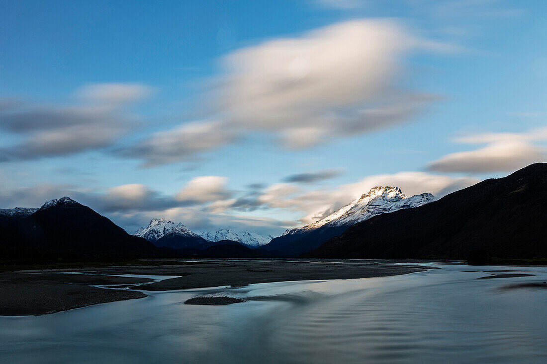 Mountains over remote river, Glenorchy, South Westland, New Zealand