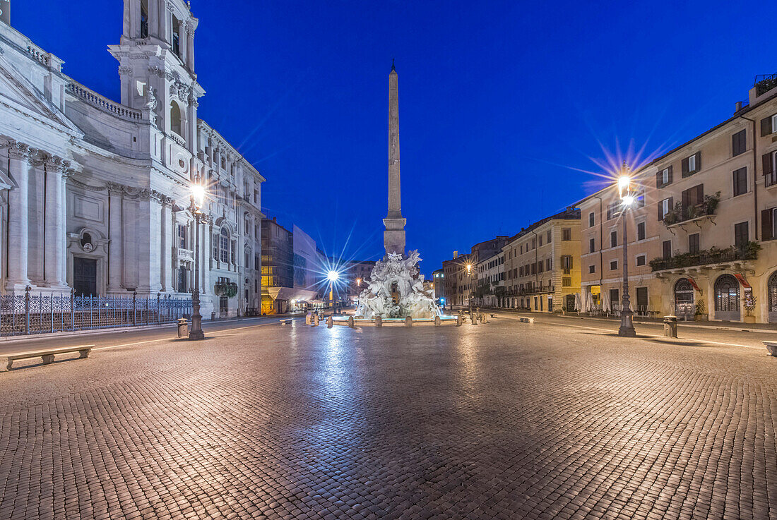 Piazza Navona and Four Rivers Fountain illuminated at night, Rome, Italy