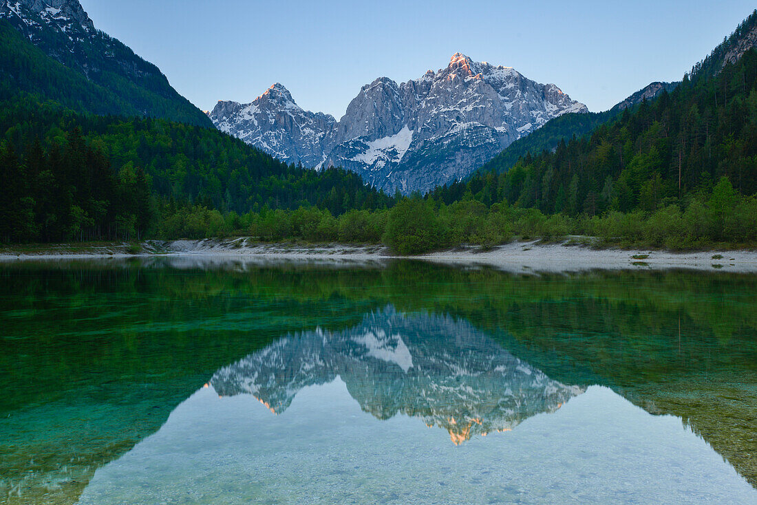 reflection of mountains among them Razor and Prisojnik in alpine lake Jasna, Kranjska Gora, Gorenjska, Triglav National Park, Julian Alps, Slovenia, Europe