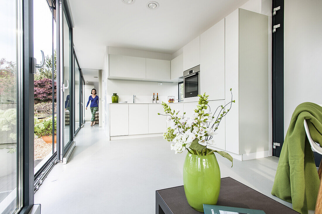 woman in a modern apartment, coodo modern way of living, modern architecture in Hamburg, north Germany, Germany