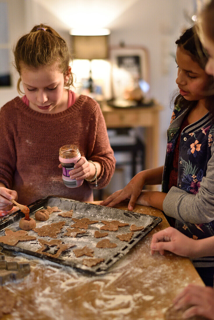 11 years old girls baking christmas cookies, Hamburg, Germany