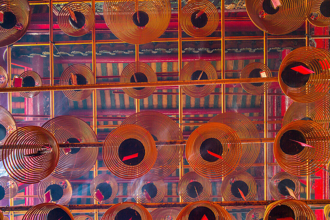 historic Man Mo temple, spiral incense coils, red, from below, graphic, traditional, religion, historic, detail, Hong Kong, China, Asia