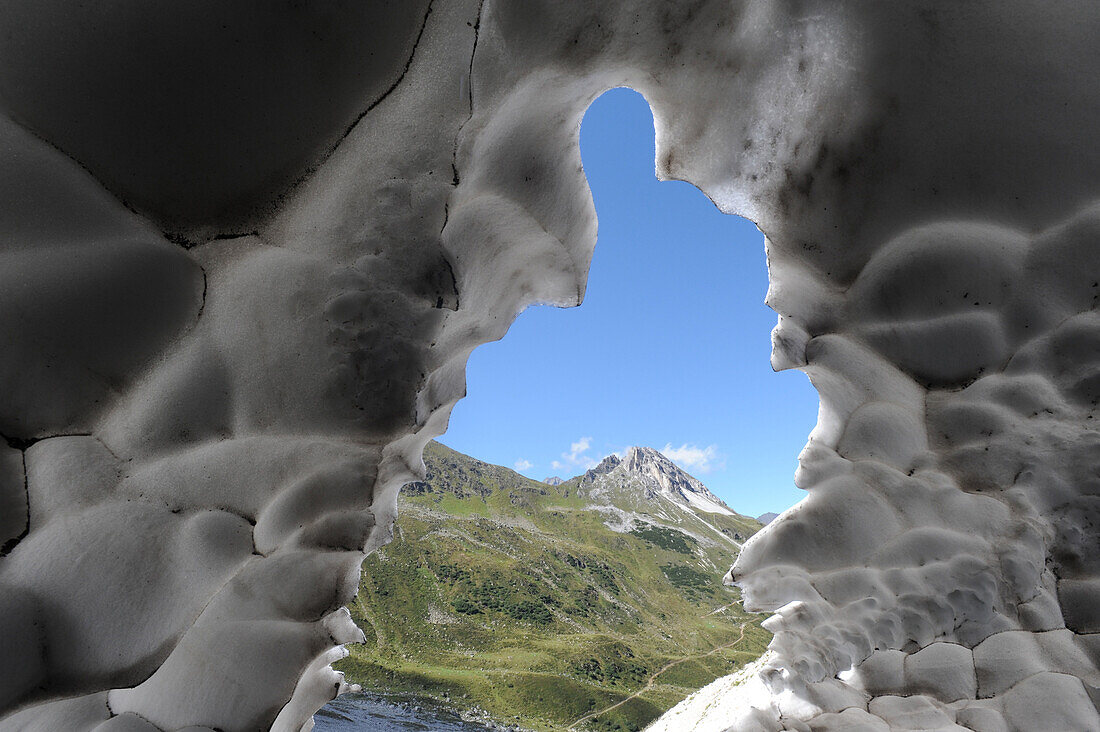 View from a snow cave to Gargglerin, Stubai Alps, Tyrol, Austria
