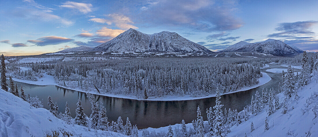 Late winter afternoon light warms up the mountains along the Takhini River, near Whitehorse, Yukon, Canada