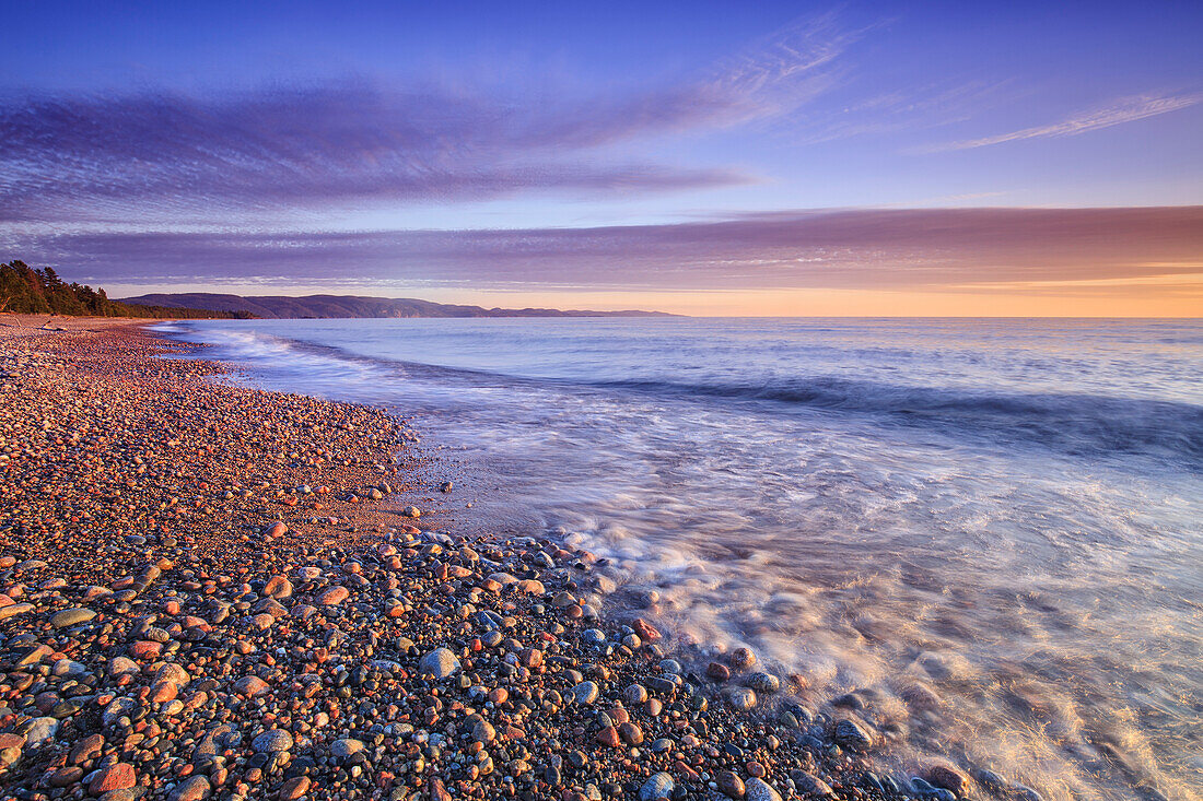 Pebble beach on Lake Superior at dusk, Agawa Bay, Lake Superior Provincial Park, Ontario, Canada