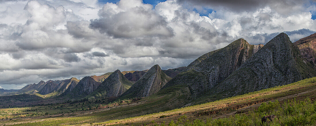 Near vertical sandstone beds form a sinuous hogs back of prominent, multicolored ridges in Toro Toro National Park, Bolivia