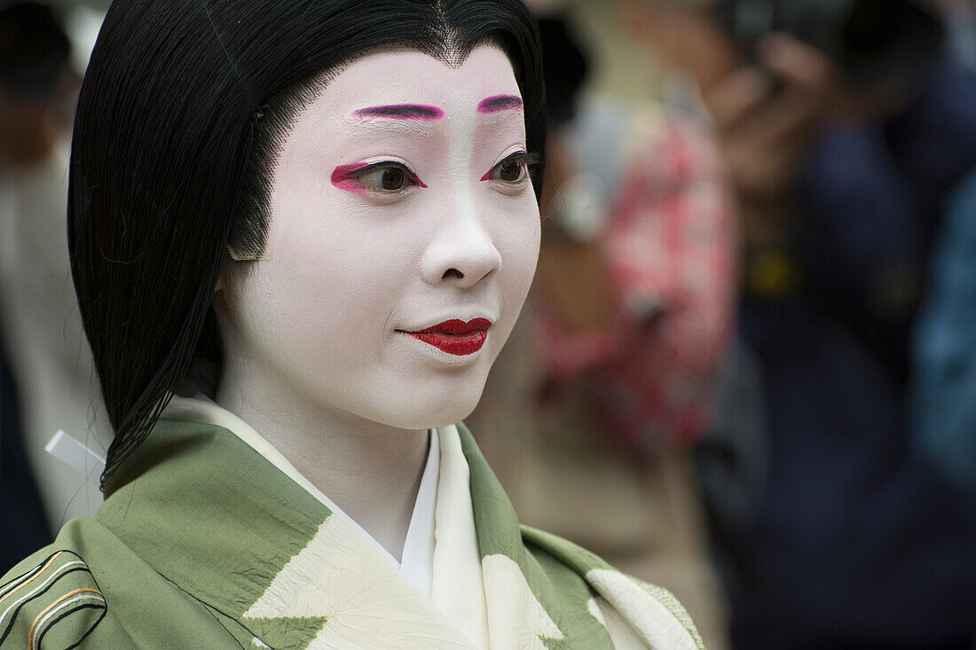 Close up portrait of a Japanese woman in kimono and parade makeup, Kyoto, Japan