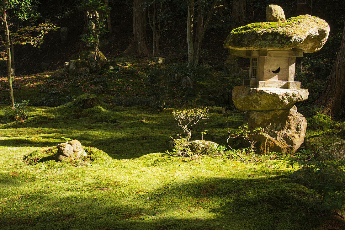 Japanese temple garden with rock lantern and moss, Ohara, Kyoto, Japan
