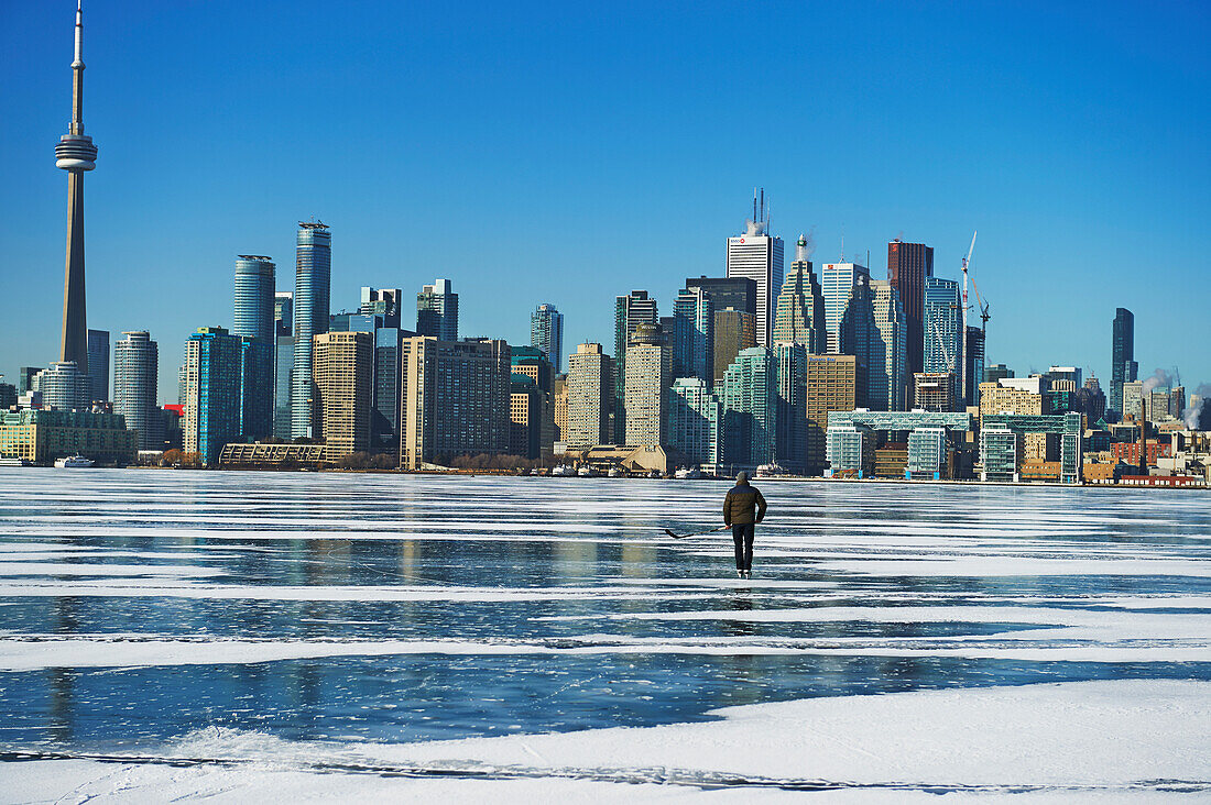 Hockey player and city skyline from Ward's Island, Toronto, Ontario, Canada