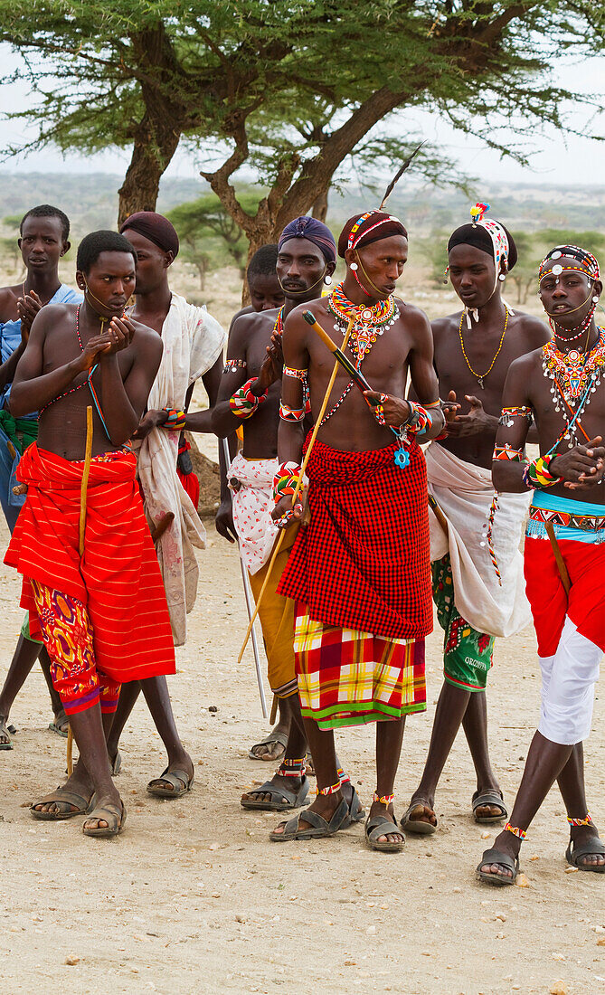 'Samburu men singing and dancing, Samburu County; Kenya'