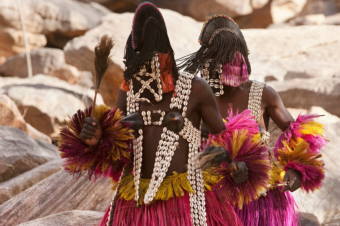 Two people wearing Kananga masks perform at the Dama celebration in Tireli, Mali