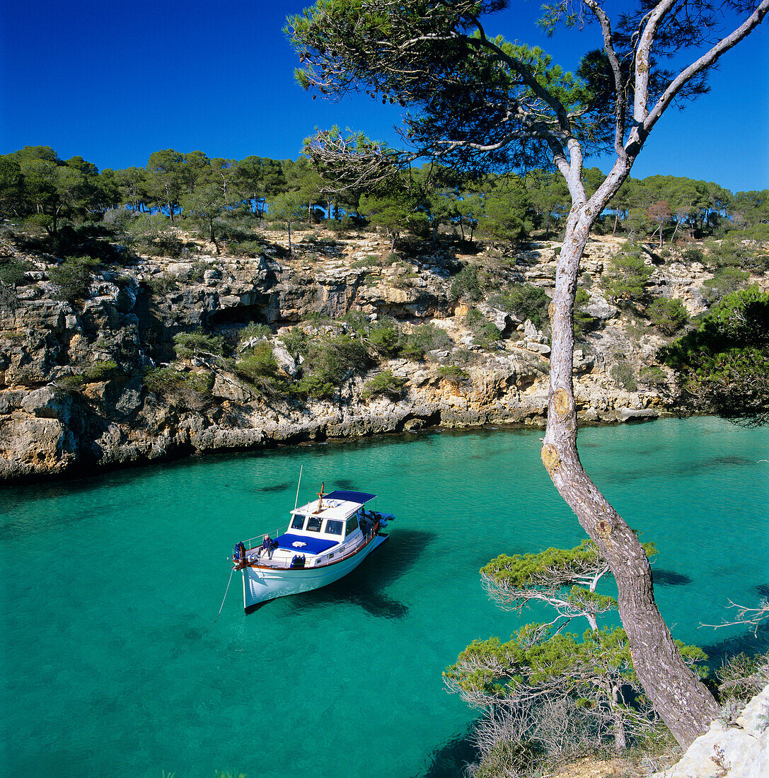 Boat anchored in rocky inlet, Cala Pi, Mallorca, Balearic Islands, Spain, Mediterranean, Europe