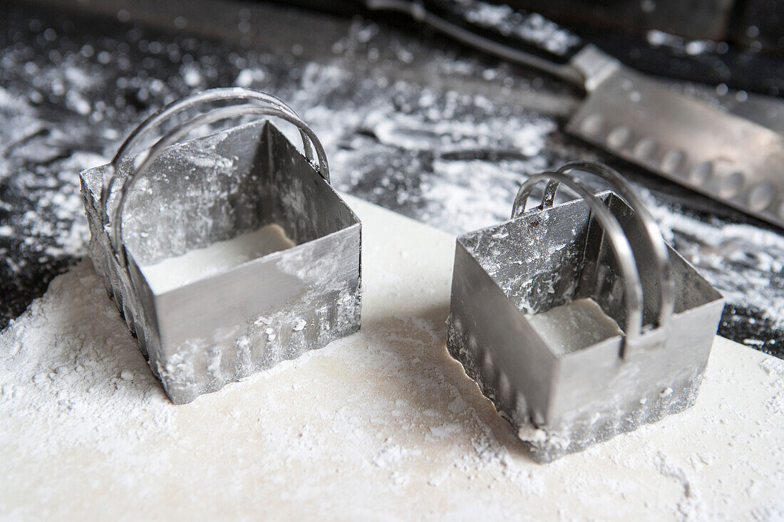 Two Cookie Cutters on Dough