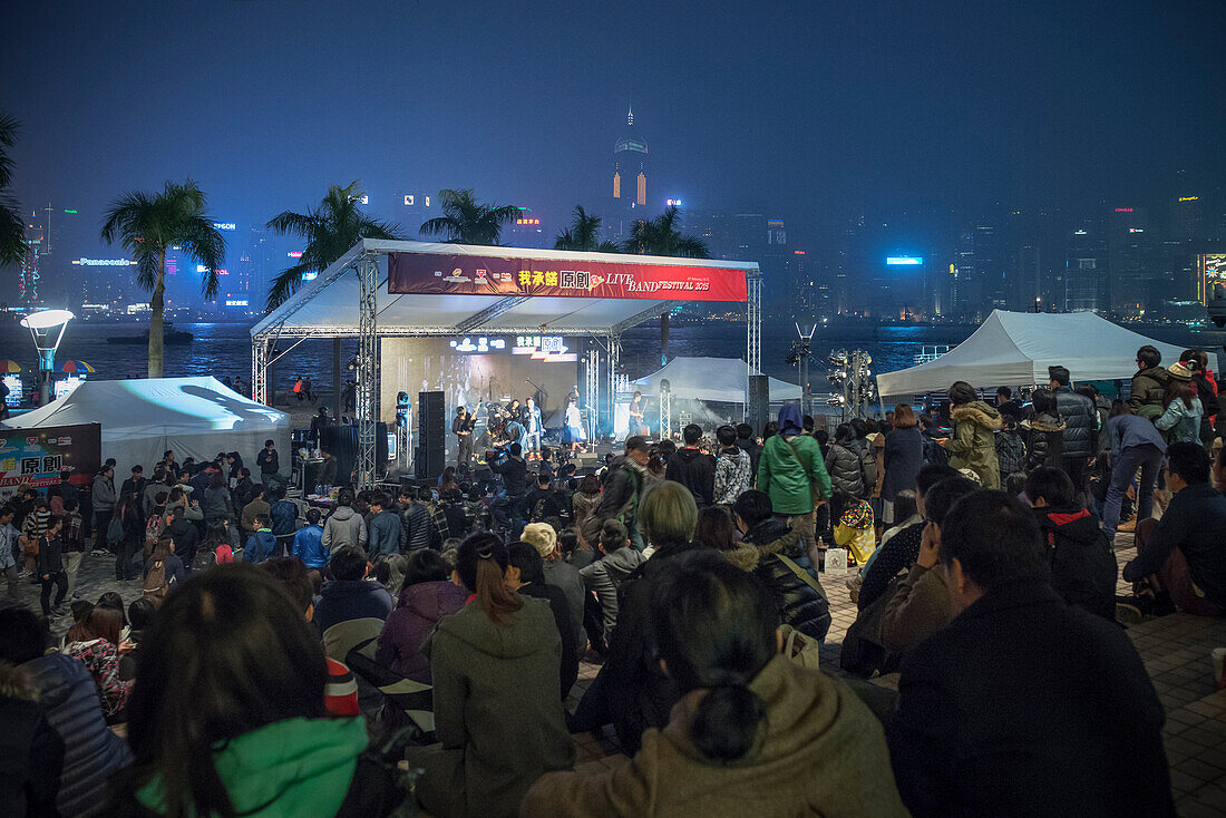 benefit concert at Museum Area at night, background with famous Hongkong Skyline, Kowloon, Hongkong, China, Asia