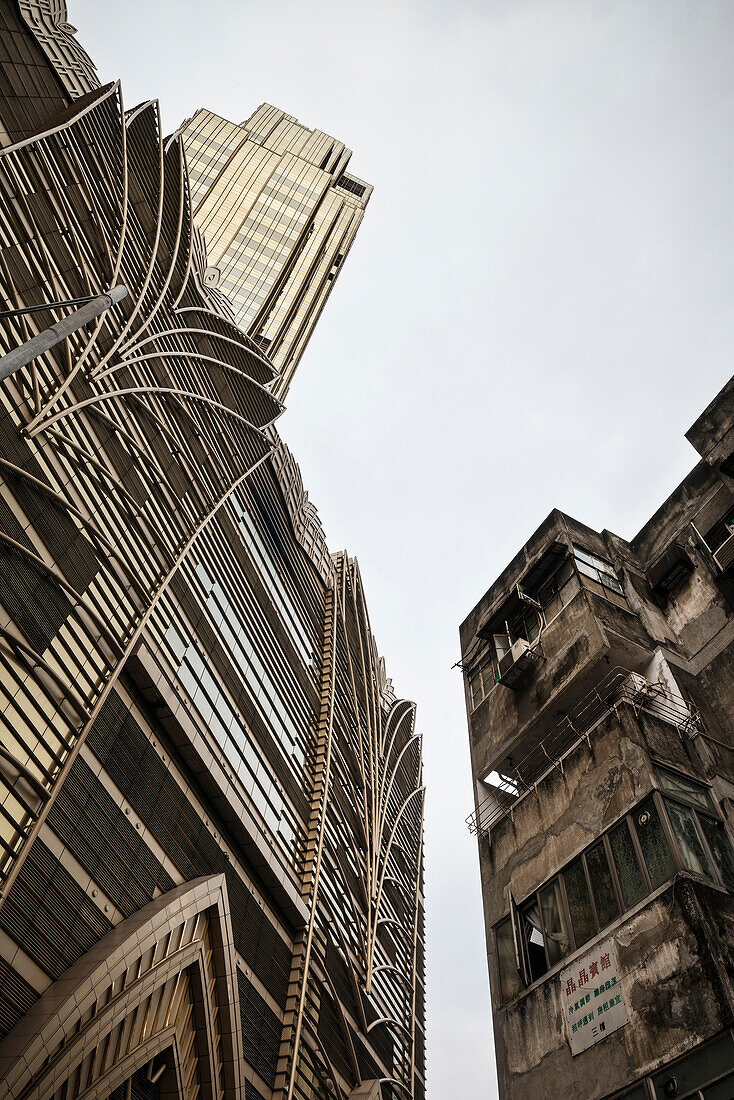 detail Grand Lisboa Casino in contrast to run down residential area, Macao, China, Asia