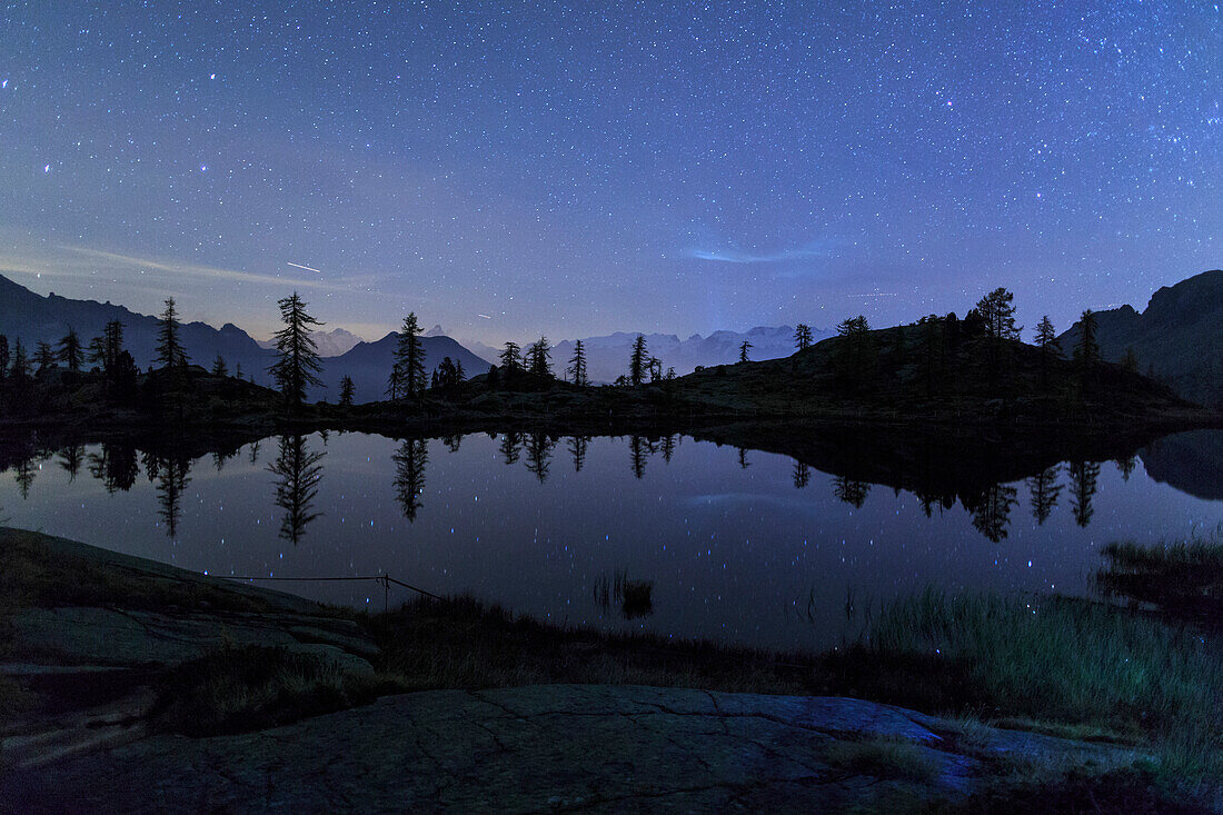 Starry night on Mount Rosa seen from Lake Vallette, Natural Park of Mont Avic, Aosta Valley, Graian Alps, Italy, Europe