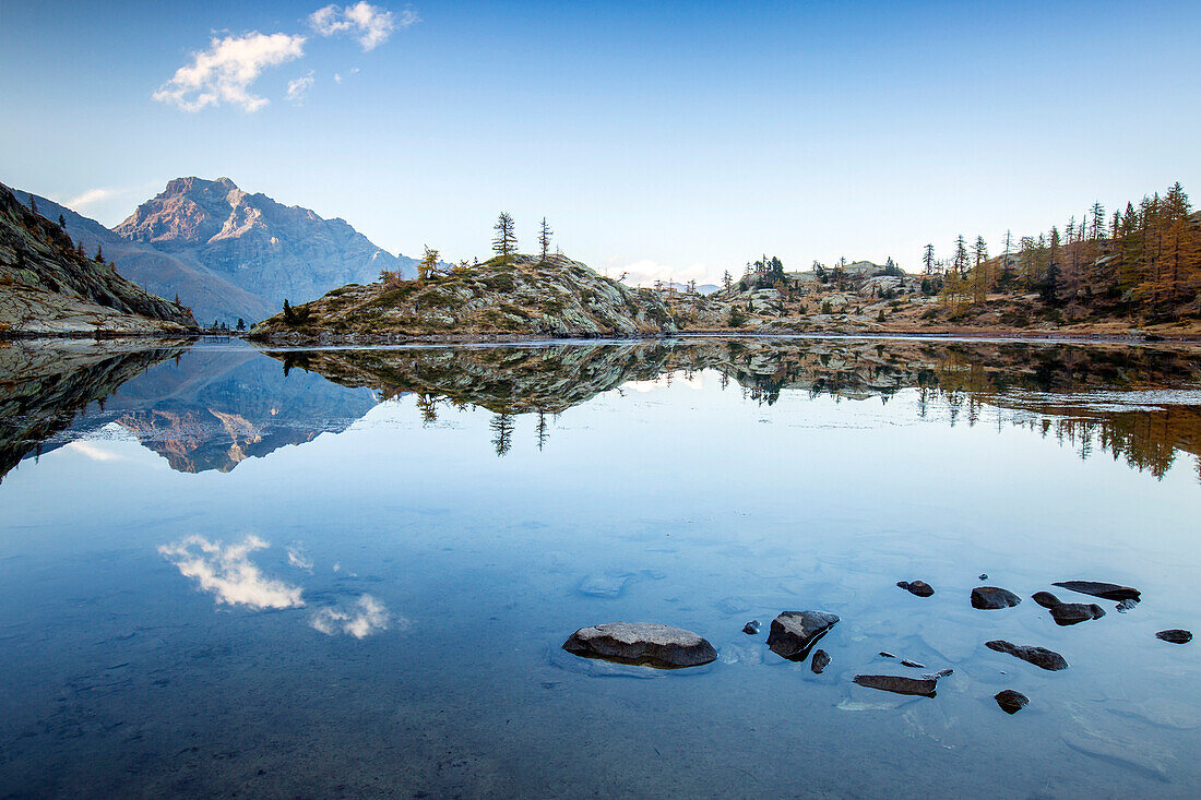 Mountain peaks reflected in Lac Blanc, Champdepraz, Natural Park of Mont Avic, Aosta Valley, Graian Alps, Italy, Europe