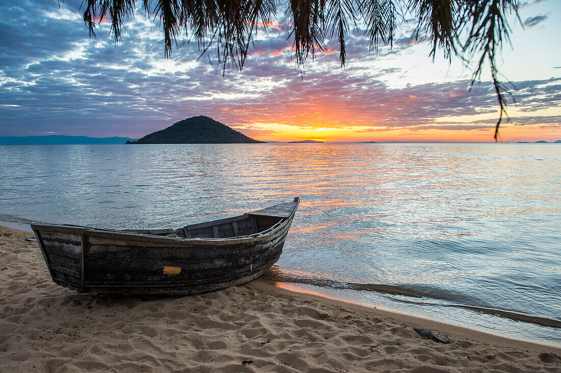 Fishing boat at sunset at Cape Malcear, Lake Malawi, Malawi, Africa