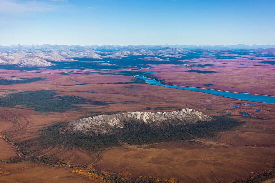 Aerial of the Noatak River, Igichuk Hills and the Baird Mountains in the distance, Noatak, Arctic Alaska, USA, Fall