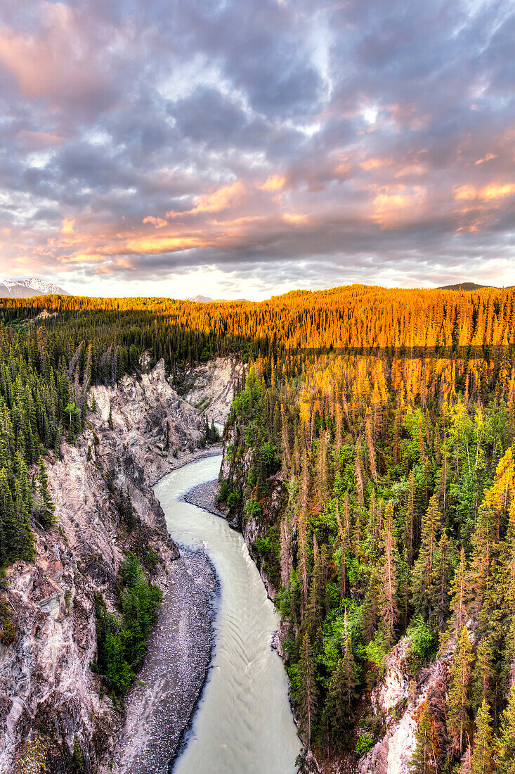 Scenic view of the Kuskulana River Canyon and Wrangell Mountains at sunset from the Kuskulana River Bridge on the McCarthy Road in Wrangell-St. Elias National Park and Preserve, Southcentral Alaska, Spring, HDR