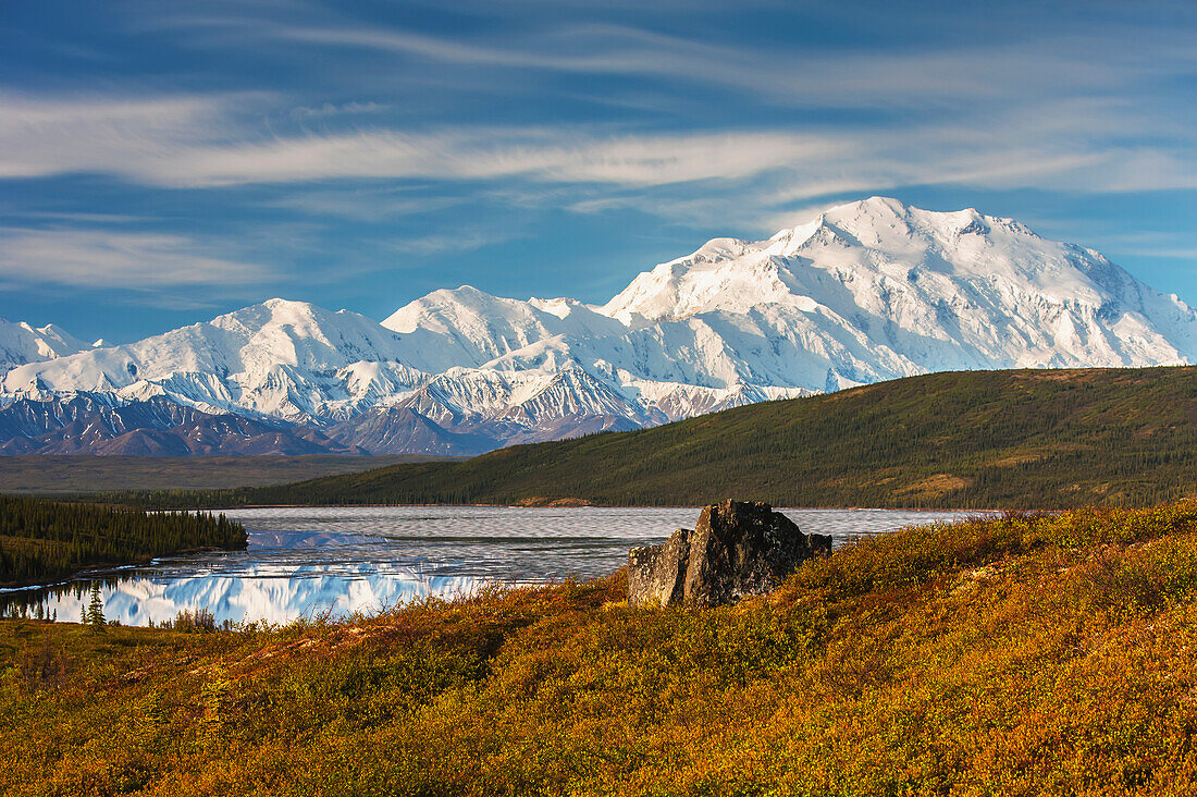 Scenic autumn view of Mt. McKinley and Wonder Lake partially covered with ice, Denali National Park, Interior Alaska