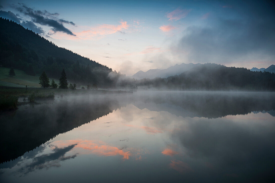 Sunrise at Lake Geroldsee with reflection, Wagenbruechsee, Kruen, near Garmisch-Partenkirchen, Upper Bavaria, Bavaria, Germany