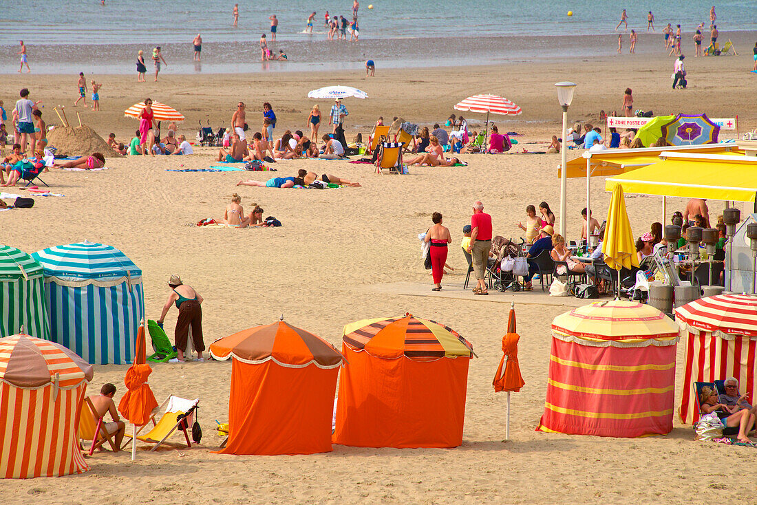 Typical color striped beach cabins, tourists, beach and sea, Trouville sur Mer, Normandy, France, Europe