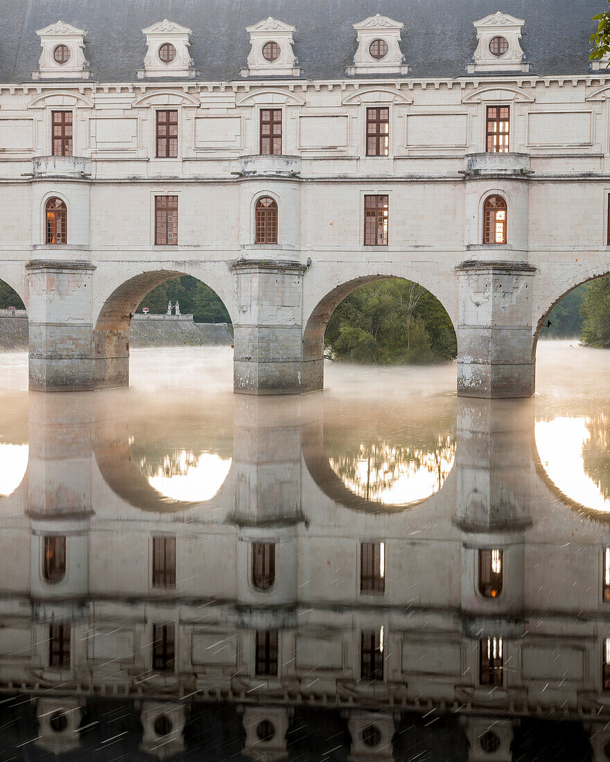 The chateau of Chenonceau, UNESCO World Heritage Site, reflecting in the River Cher at sunrise, Indre-et-Loire, Centre, France, Europe