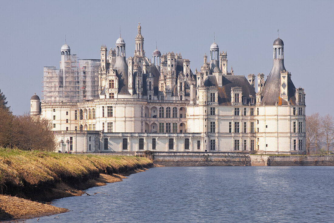 The beautiful 16th century Chateau de Chambord, UNESCO World Heritage Site, across the waters of the canal in front of it, Chambord, Loir-et-Cher, Centre, France, Europe