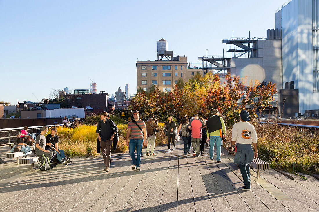 People walking along the High line, an elevated section of a disused New York Central Railroad, downtown, Manhattan, New York City, USA, America