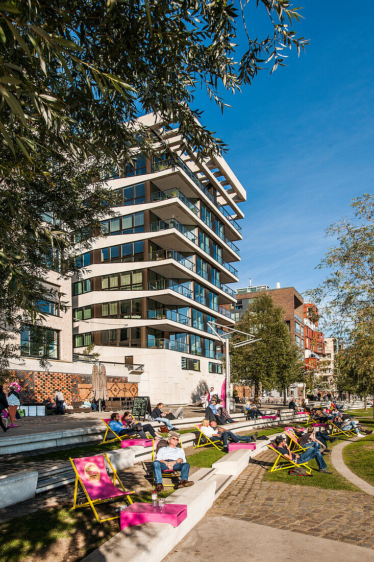 people chilling at the Dalmannkai in the Hafencity of Hamburg, north Germany, Germany