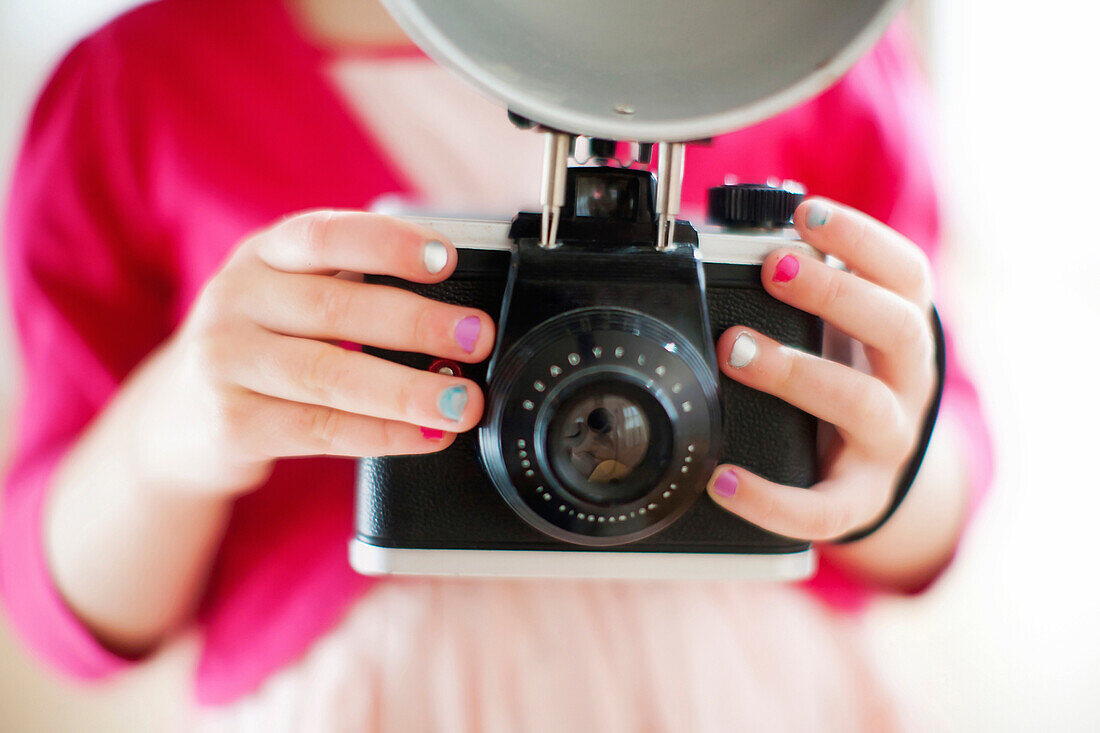 Close up of girl holding camera