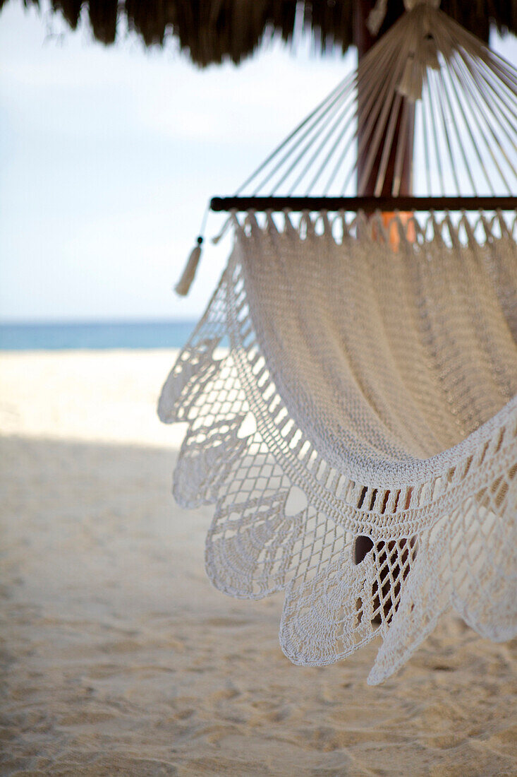 Close up of hammock hanging on tropical beach
