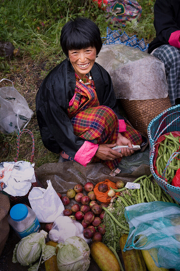 Asian woman smiling at market