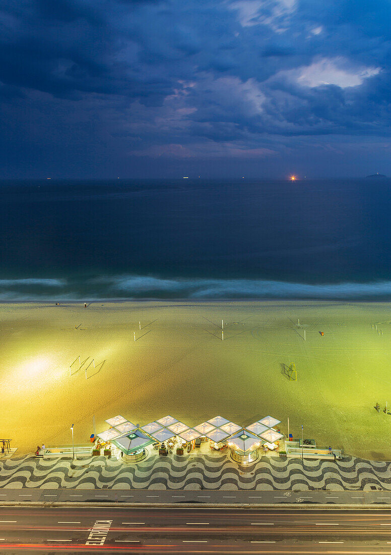 Aerial view of market on beach under cloudy sky