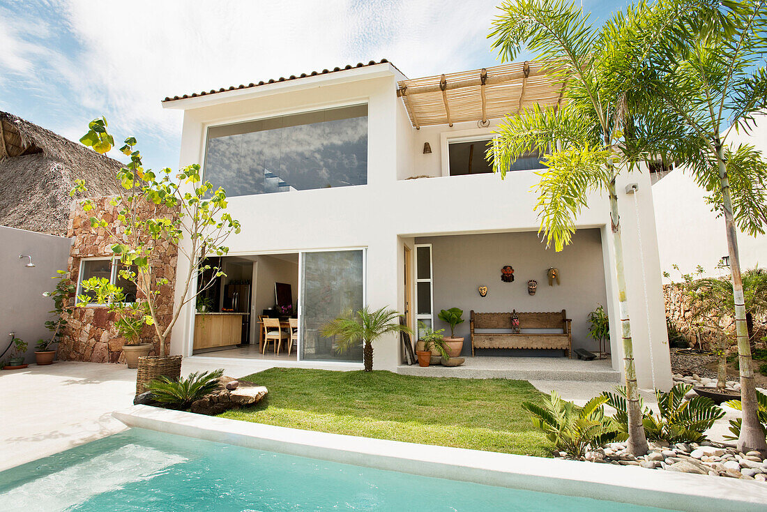 Swimming pool in backyard of modern home