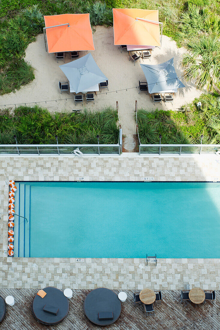 High angle view of tables at hotel swimming pool