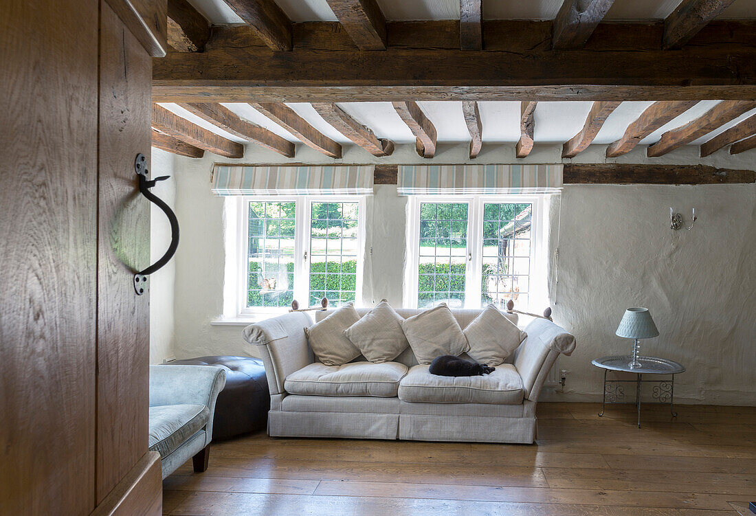 Sofa under beams in living room