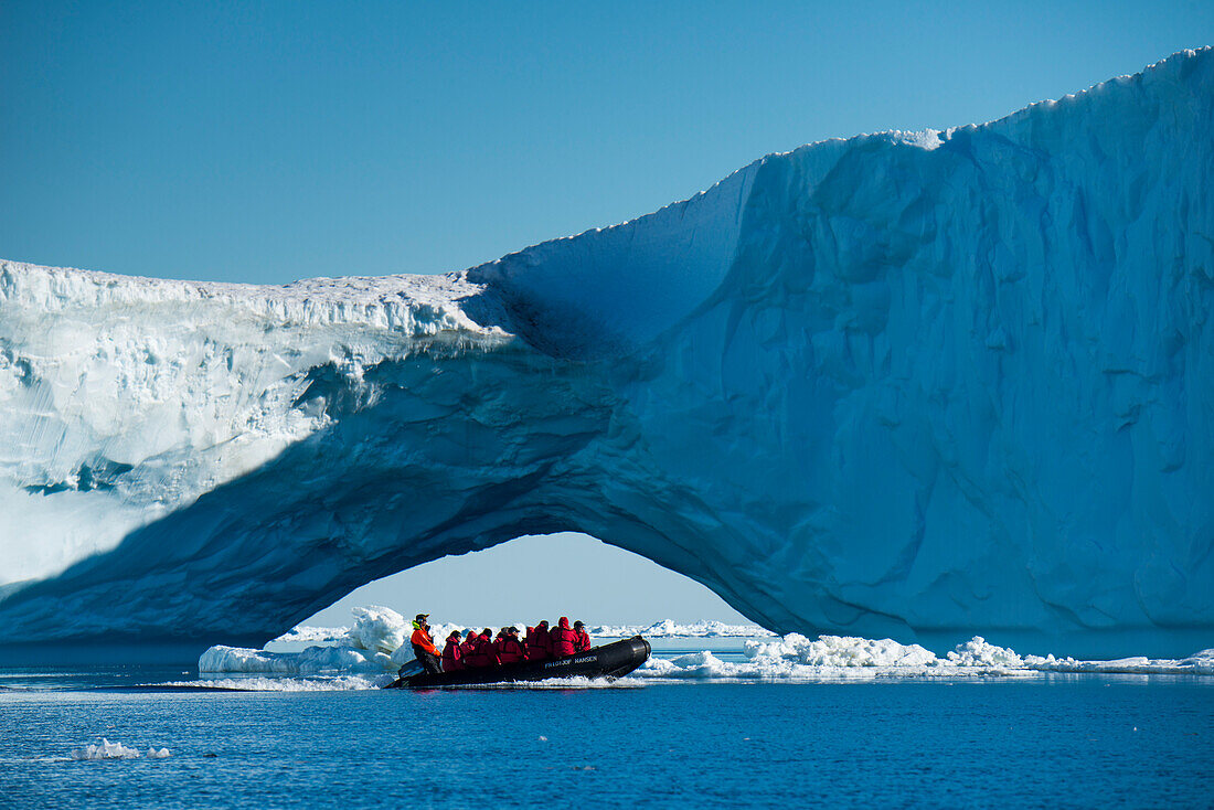 Zodiac raft excursion through ice floes and to iceberg for passengers of expedition cruise ship MS Hanseatic Hapag-Lloyd Cruises, Weddell Sea, Antarctic Peninsula, Antarctica