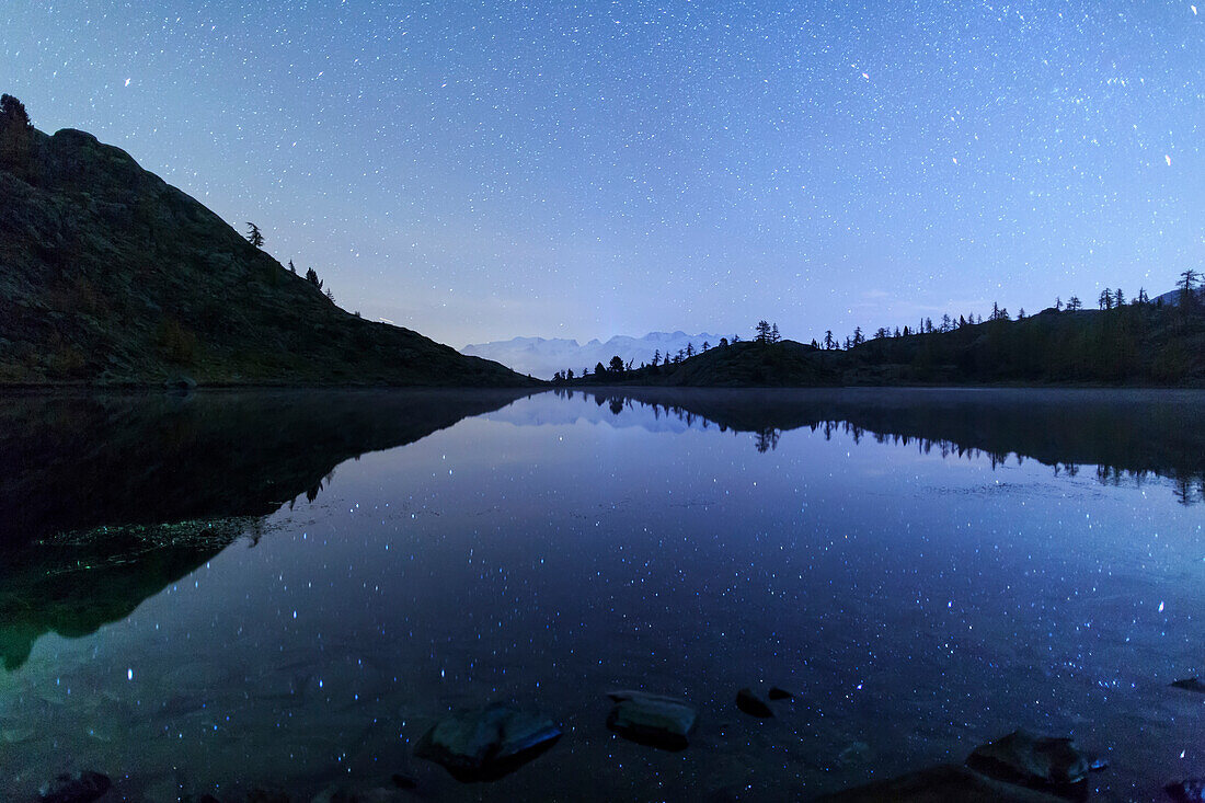 Starry night on Mount Rosa seen from Lake Vallette, Natural Park of Mont Avic, Aosta Valley, Graian Alps, Italy, Europe