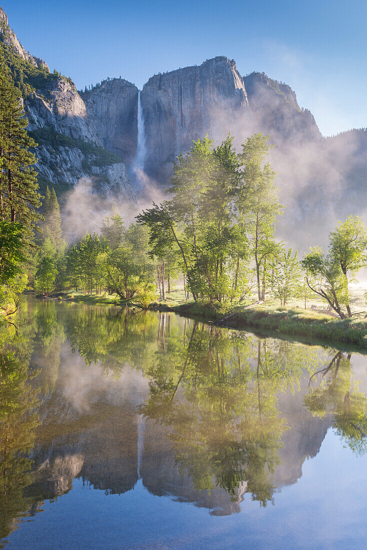 Yosemite Falls reflected in the Merced River at dawn, Yosemite National Park, UNESCO World Heritage Site, California, United States of America, North America