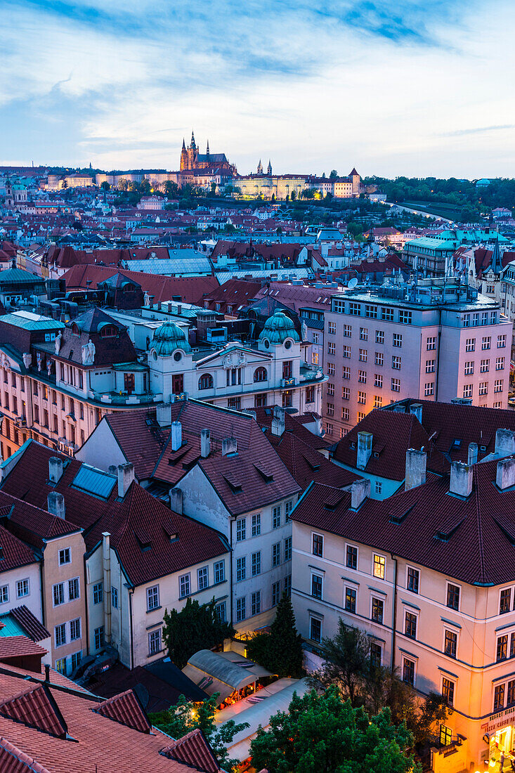 View over the Old Town rooftops towards St. Vitus's Cathedral at dusk, UNESCO World Heritage Site, Prague, Czech Republic, Europe