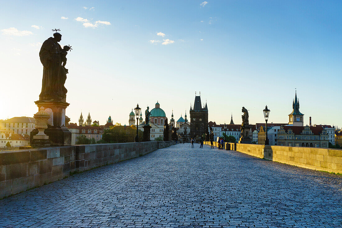 Early morning on Charles Bridge looking towards the Old Town, UNESCO World Heritage Site, Prague, Czech Republic, Europe