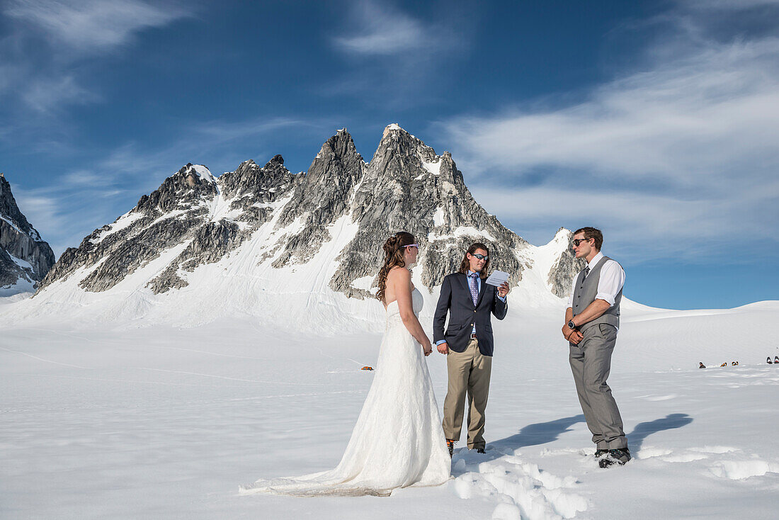 Adventurous bride and groom get married on a glacier in Denali National Park.