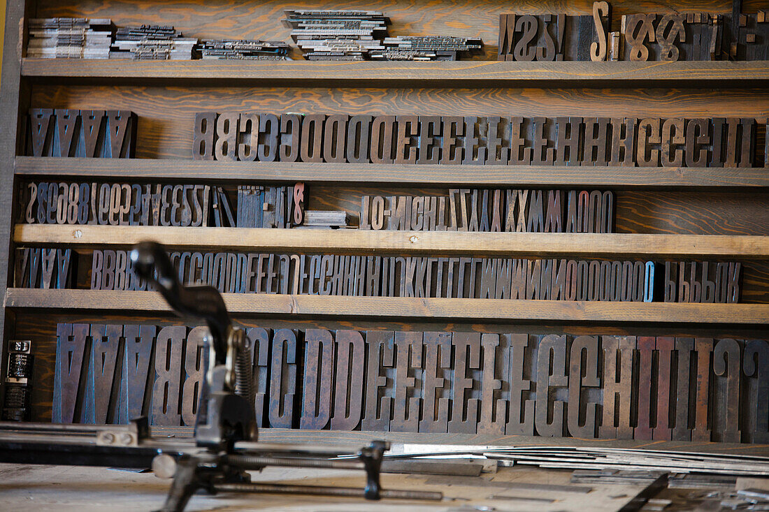 Large letters used in an antique printing press.
